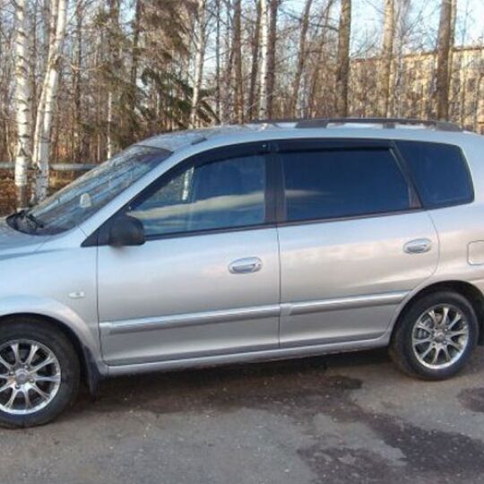 COBRA TUNING Дефлекторы окон на Kia Carens II '02-06 (накладные)