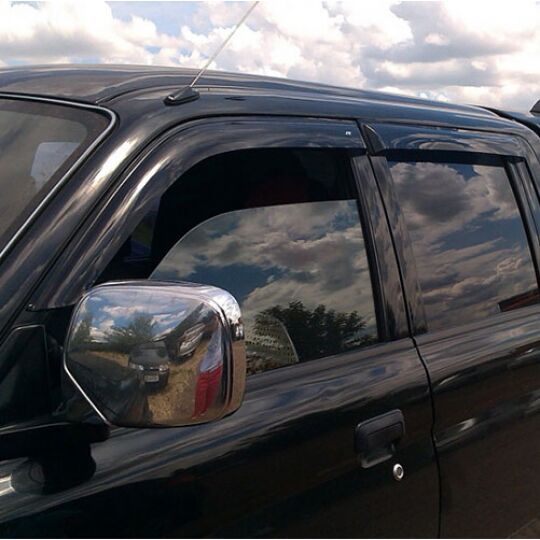 COBRA TUNING Дефлекторы окон на Mitsubishi L200 III '96-06 (накладные)