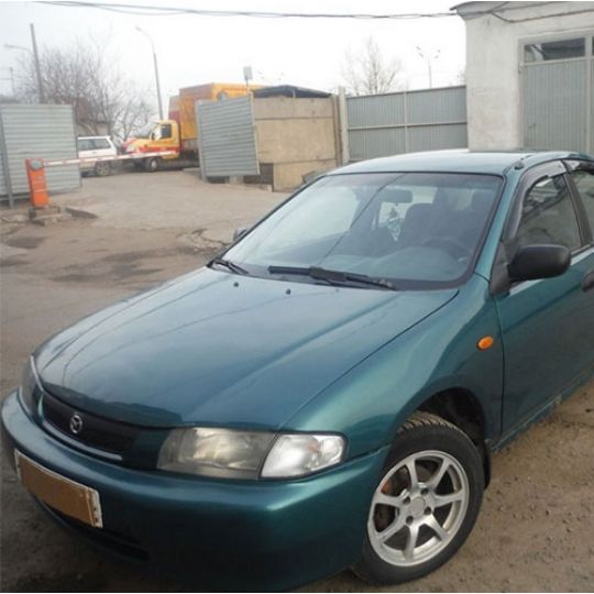 COBRA TUNING Дефлекторы окон на Mazda 323 (BA, BH) '94-97 седан (накладные)